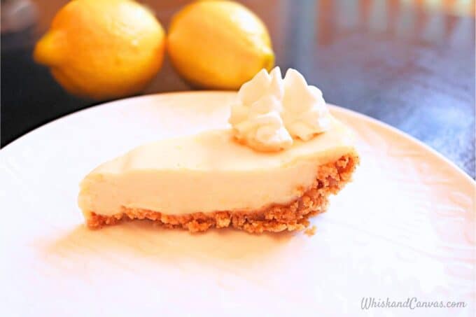 Slice of creamy lemon pie on a plate.