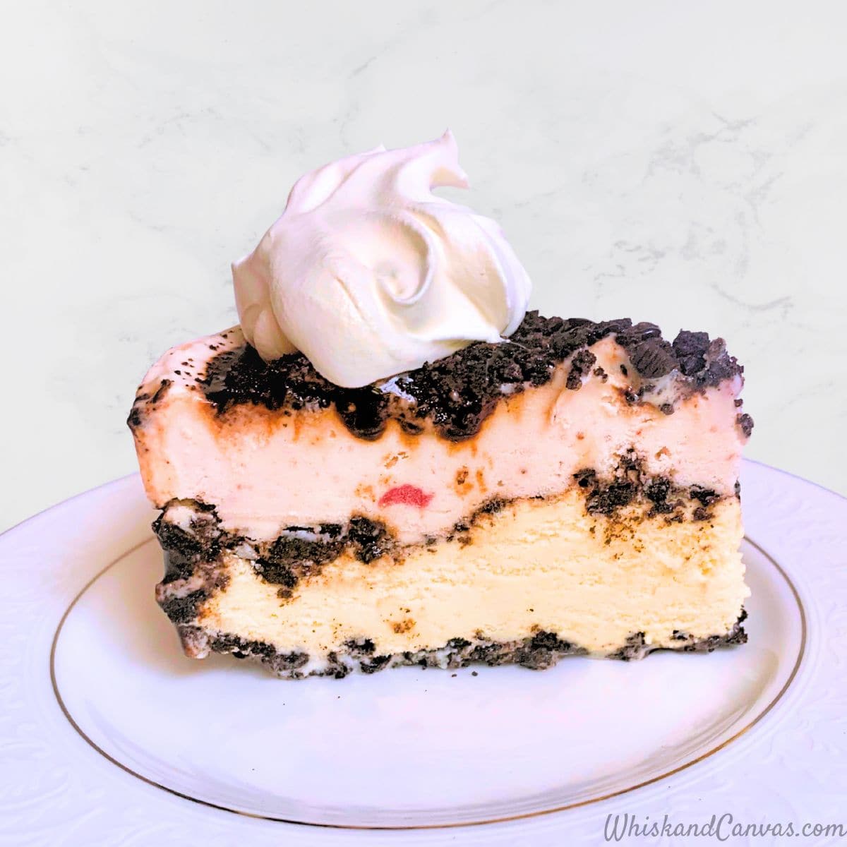 Neapolitan Ice Cream Cake slice on a plate.